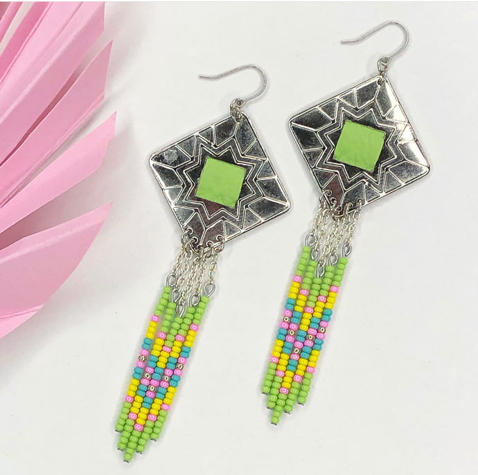 Diamond shaped silver concho with lime green, pink, yellow and turquoise dangling bead work on fishhooks