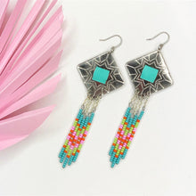Load image into Gallery viewer, Diamond shaped silver concho with Turquoise, green, pink and orange dangling bead work on fishhooks