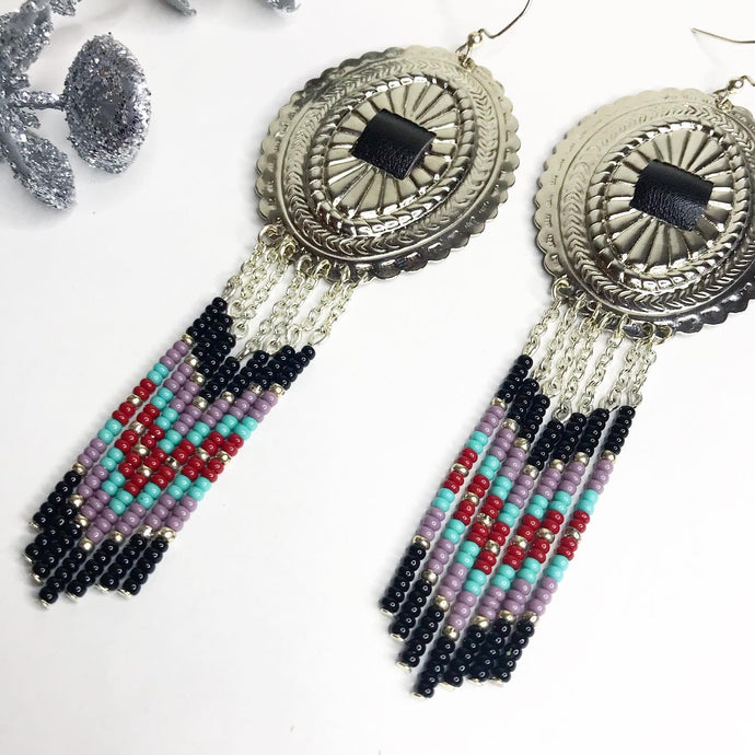 Large Silver Concho with dangly beading in black, dusty lavender, turquoise and deep red finished on fishhooks