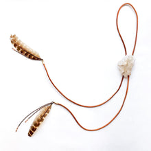 Load image into Gallery viewer, Quartz Crystal Bolo Tie on cognac brown leather cord finished at the ends with feathers and chain detailing
