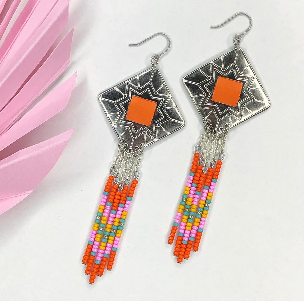 Diamond shaped silver concho with orange, pink, turquoise and yellow dangling bead work on fishhooks