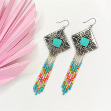 Load image into Gallery viewer, Diamond shaped silver concho with Turquoise, green, pink and orange dangling bead work on fishhooks
