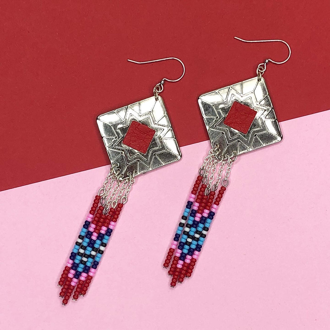 Diamond shaped silver concho with red, pink, baby blue & navy dangling bead work on fishhooks