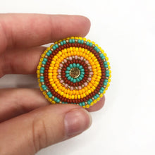 Load image into Gallery viewer, Beaded medallion with golden yellow, bright yellow, burgundy, turquoise and matte pink beads

