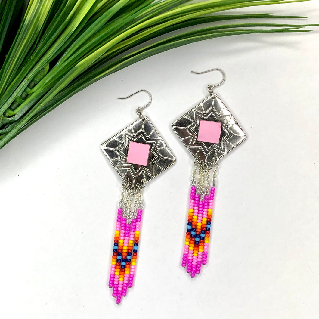 Diamond shaped silver concho with magenta, pink, yellow and blue dangling bead work on fishhooks