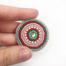 Load image into Gallery viewer, Beaded medallion with matte pink, turquoise, dark red and gold beads

