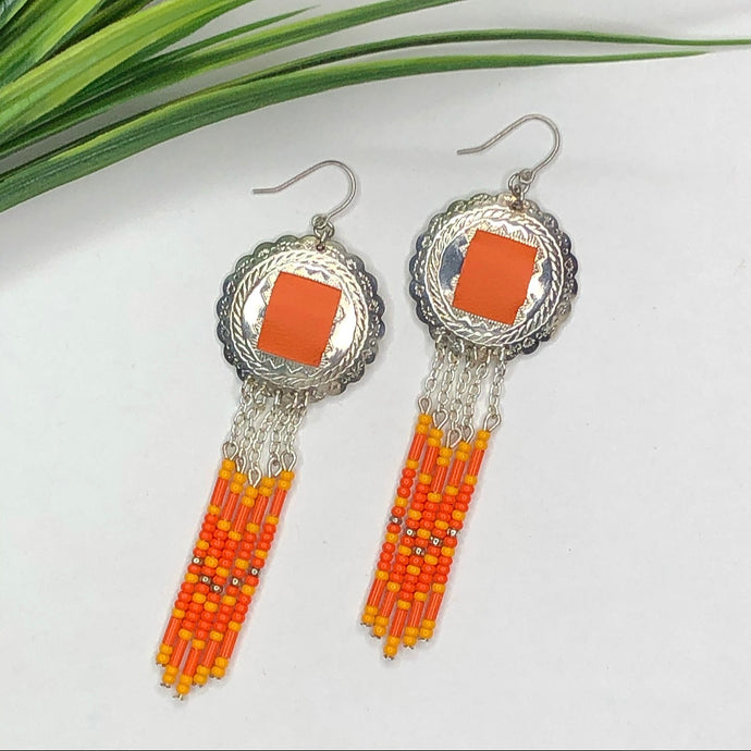 Silver Scalloped Concho earrings with monochromatic orange beading dangling down finished with fish hooks