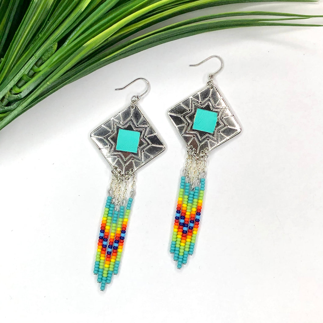 Diamond shaped silver concho with turquoise, lime green, orange and blue dangling bead work on fishhooks