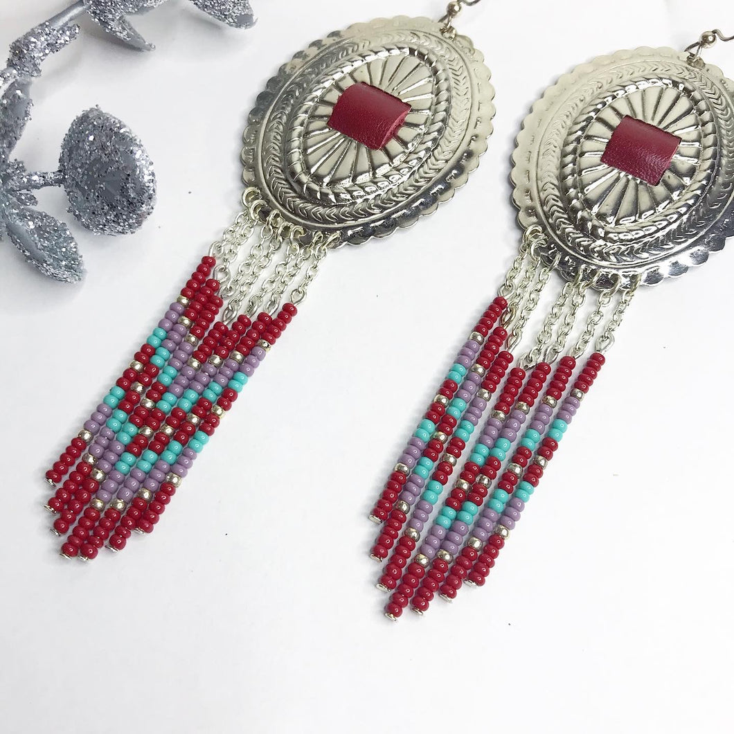 Large Silver Concho with dangly beading in dark red, dusty lavender and turquoise finished on fishhooks