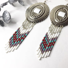 Load image into Gallery viewer, Large Silver Concho with dangly beading in white, dusty lavender, deep red and turquoise finished on fishhooks
